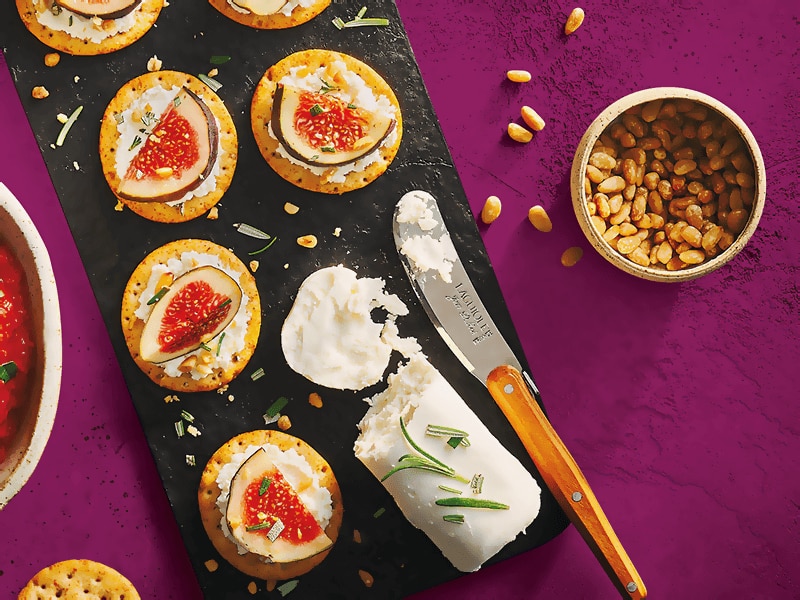 Toasteds Crackers topped with Goat Cheese, Fig and Pine Nuts